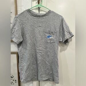 Grey vineyard vines with a sail boat on the back.